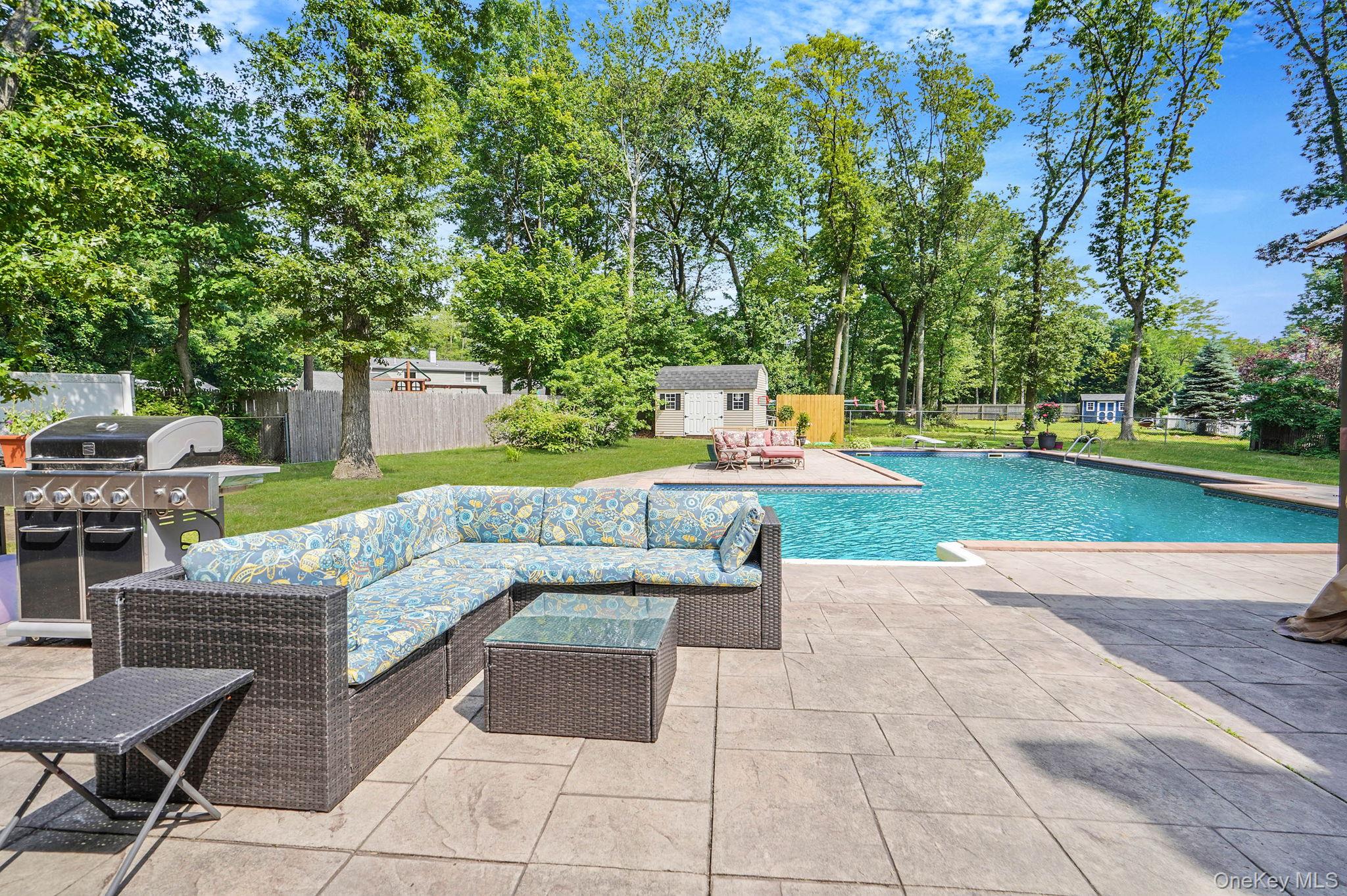 318 Sheep Pasture Road East Setauket, NY 11733 - Photo 41 of 45 a view of a backyard with swimming pool