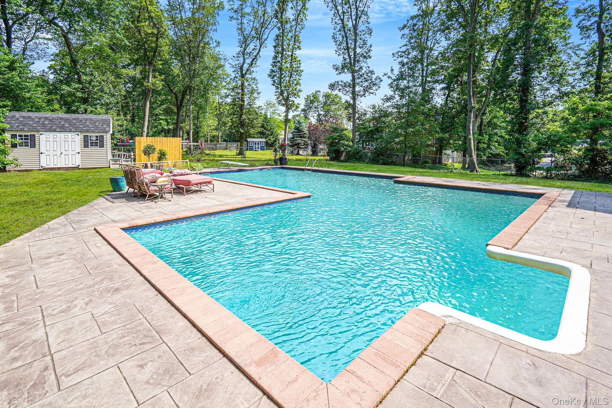 318 Sheep Pasture Road East Setauket, NY 11733 - Photo 42 of 45 a view of a house with pool