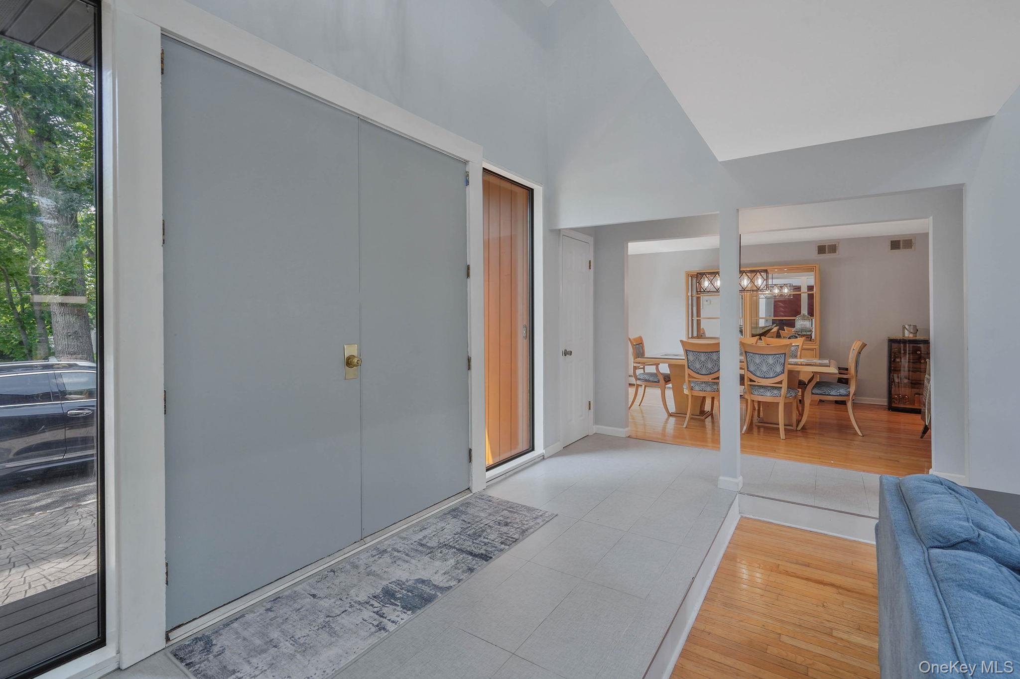 318 Sheep Pasture Road East Setauket, NY 11733 - Photo 5 of 45 a living room with furniture and wooden floor
