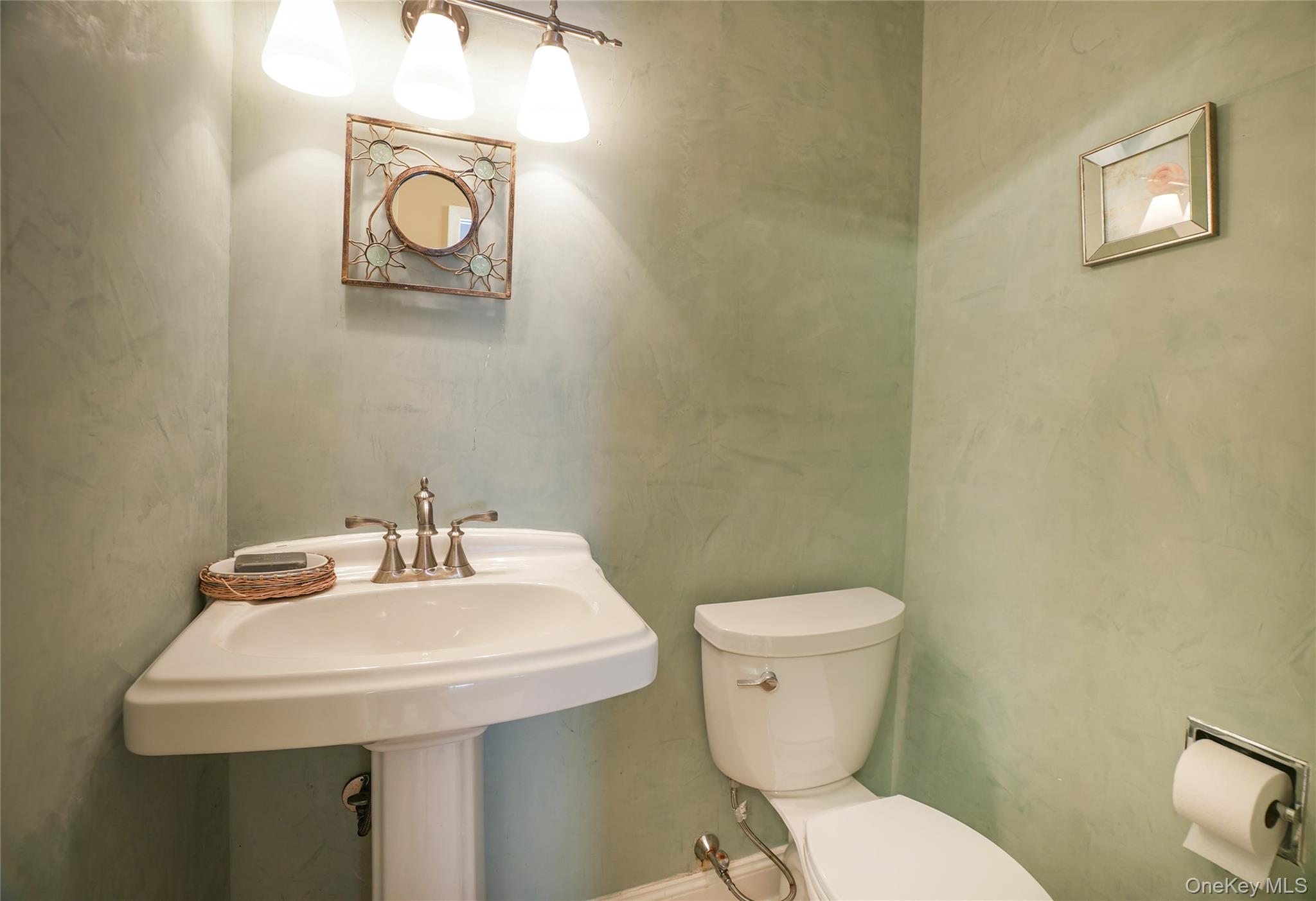 22 Peters Lane Pound Ridge, NY 10576 - Photo 35 of 43 Powder room conveniently in the mudroom.