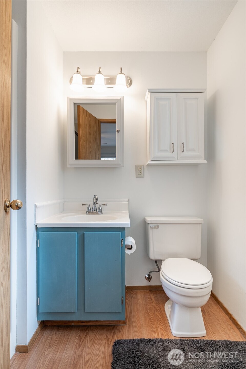 14031 33rd Place South Tukwila, WA 98168 - Photo 17 of 37 a bathroom with a toilet sink and mirror