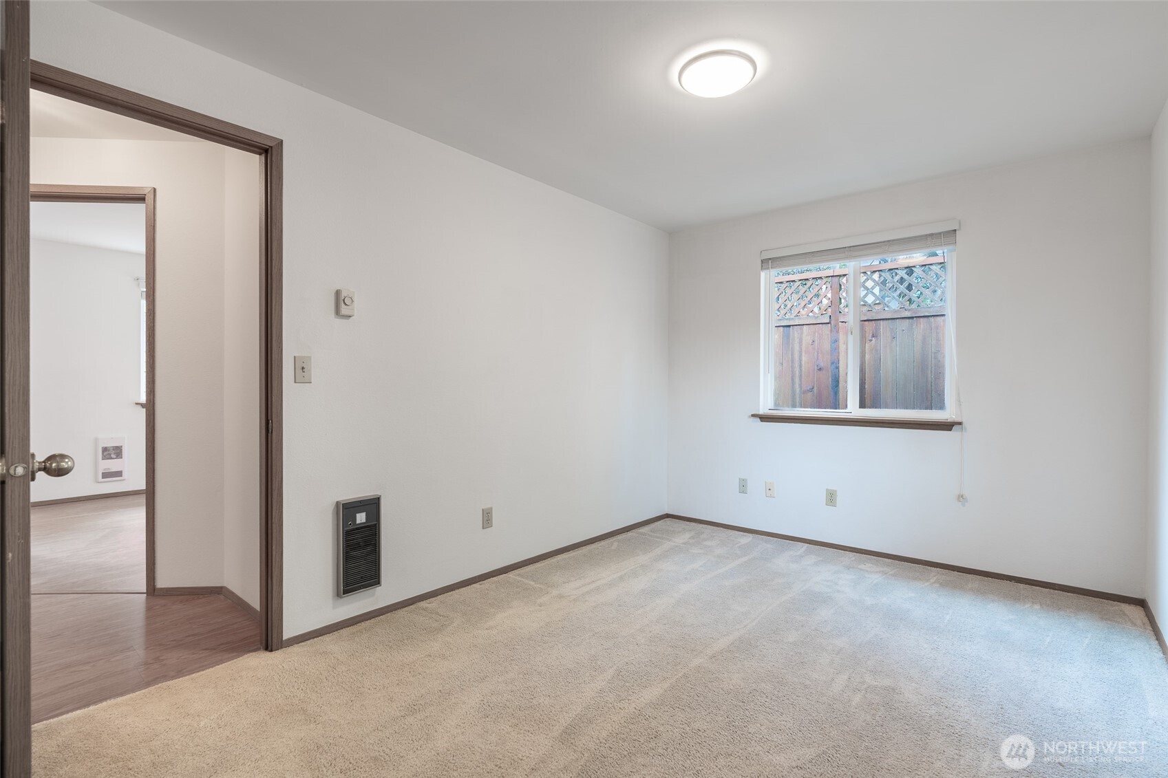 14031 33rd Place South Tukwila, WA 98168 - Photo 19 of 37 an empty room with windows and closet