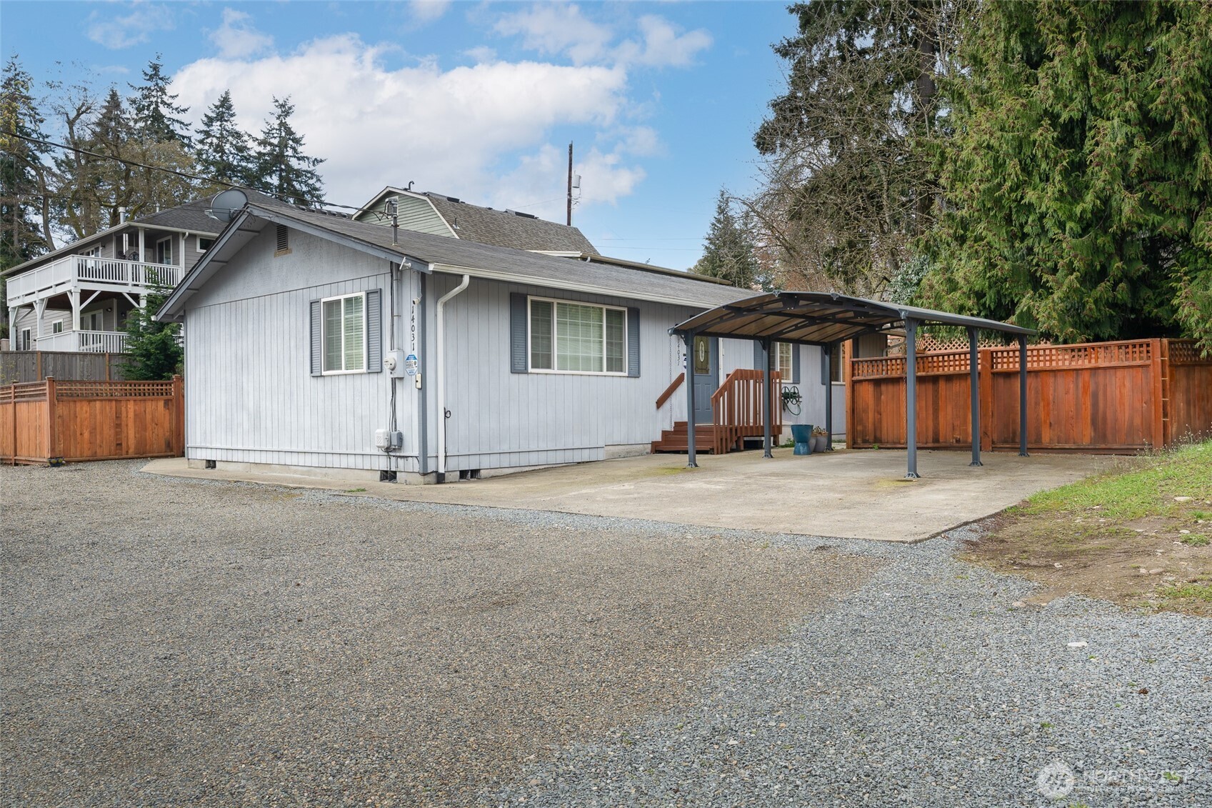 14031 33rd Place South Tukwila, WA 98168 - Photo 2 of 37 a view of a house with a yard and large tree