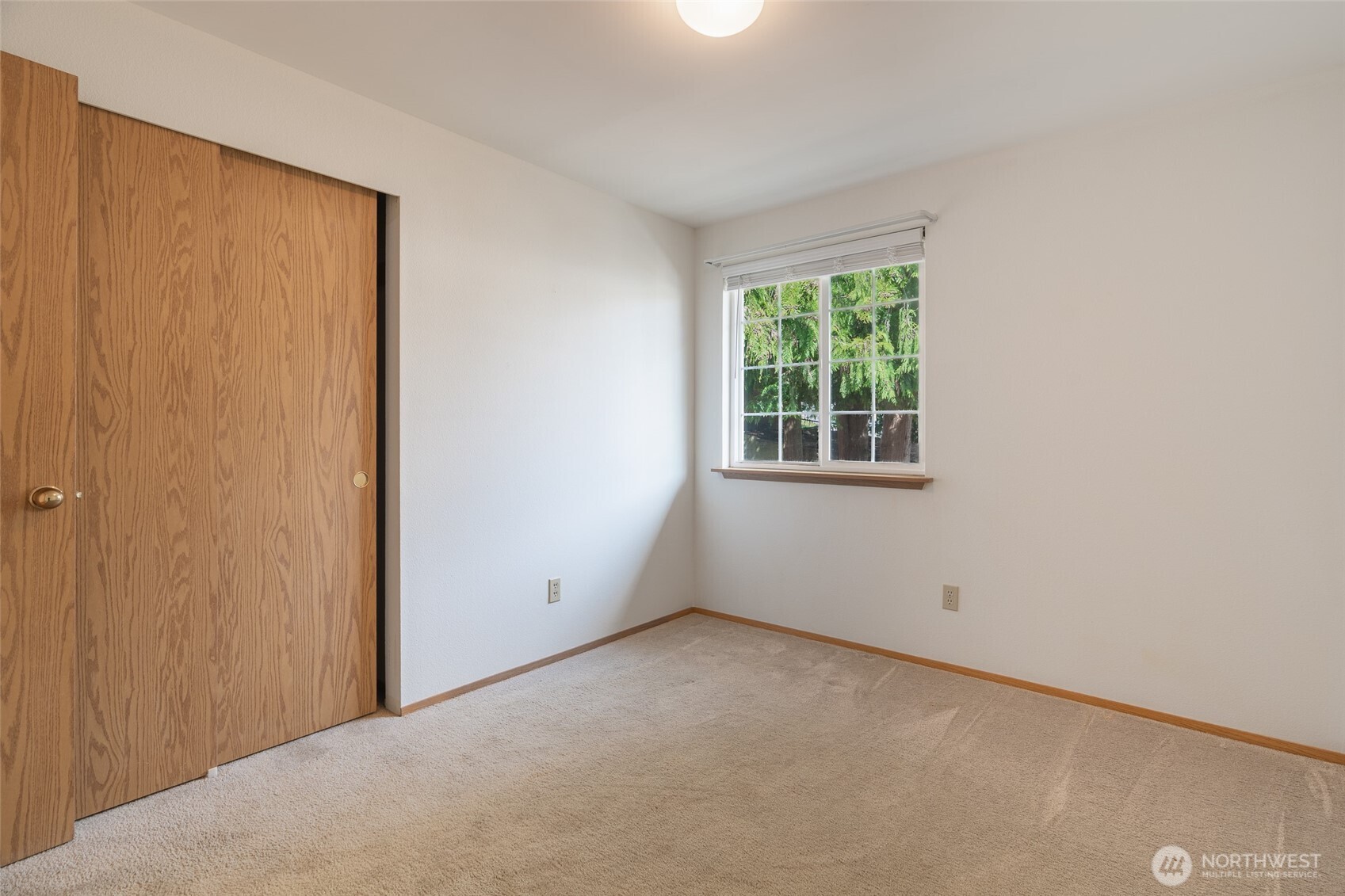 14031 33rd Place South Tukwila, WA 98168 - Photo 23 of 37 an empty room with a window