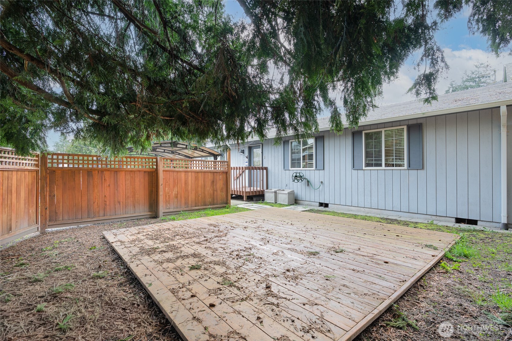 14031 33rd Place South Tukwila, WA 98168 - Photo 28 of 37 a front view of a house with a yard and garage