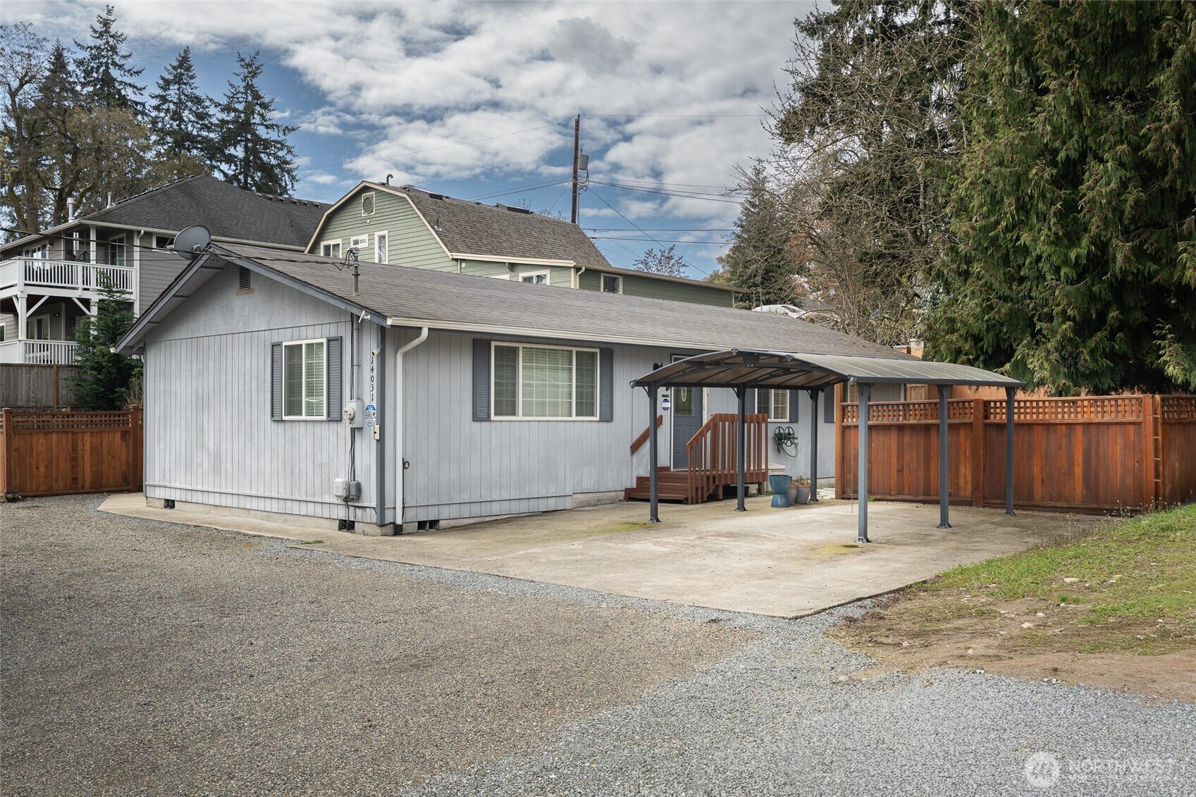 14031 33rd Place South Tukwila, WA 98168 - Photo 4 of 37 a view of a house with a yard and wooden fence