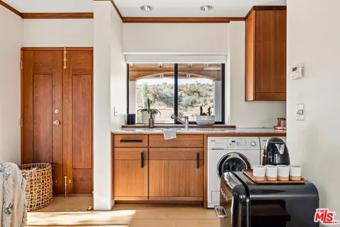 a kitchen with a stove a sink and a refrigerator