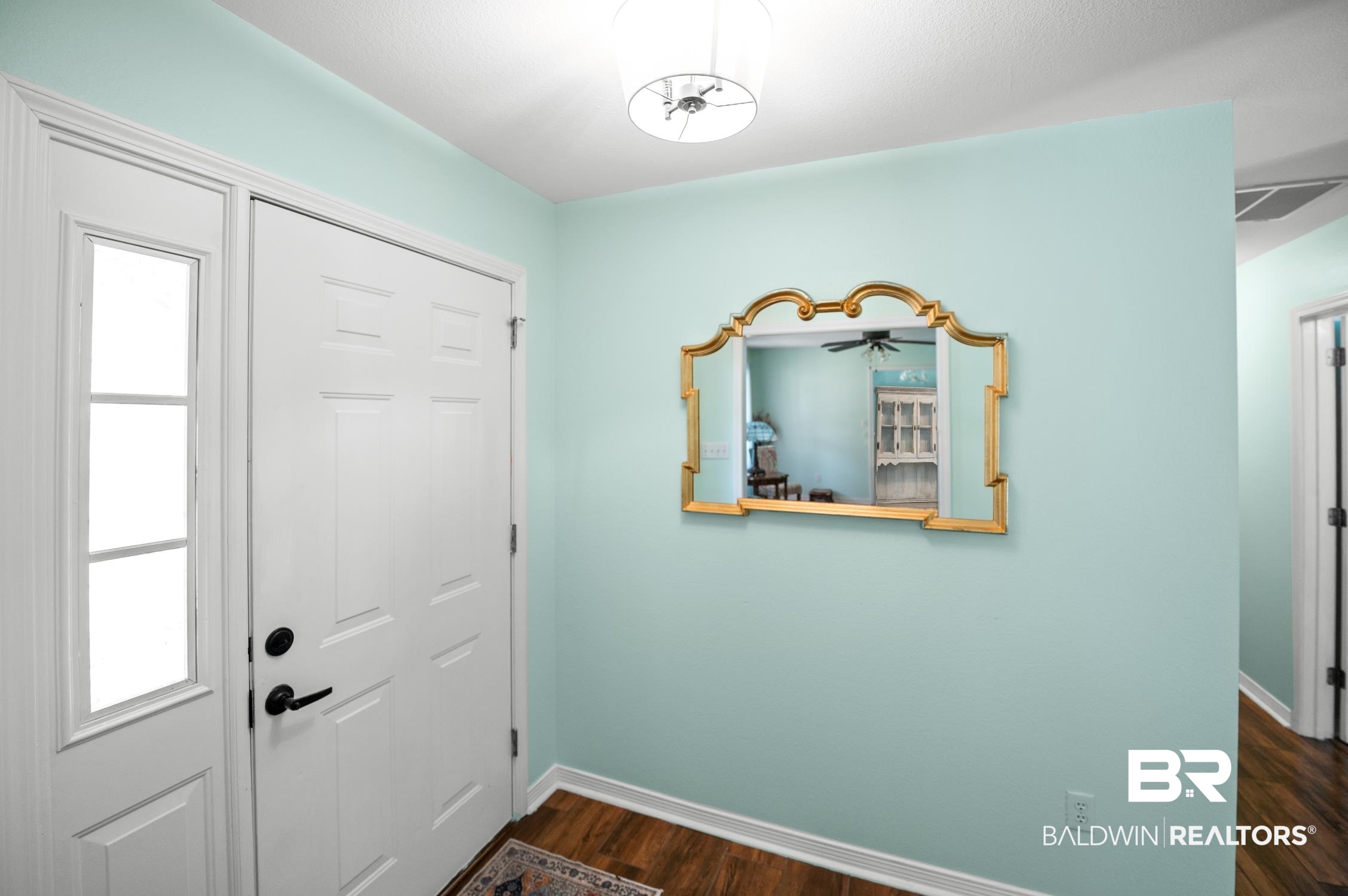 2553 Santa Rosa Drive Lillian, AL 36549 - Photo 35 of 51 Foyer entrance featuring dark wood finished floors, visible vents, and baseboards