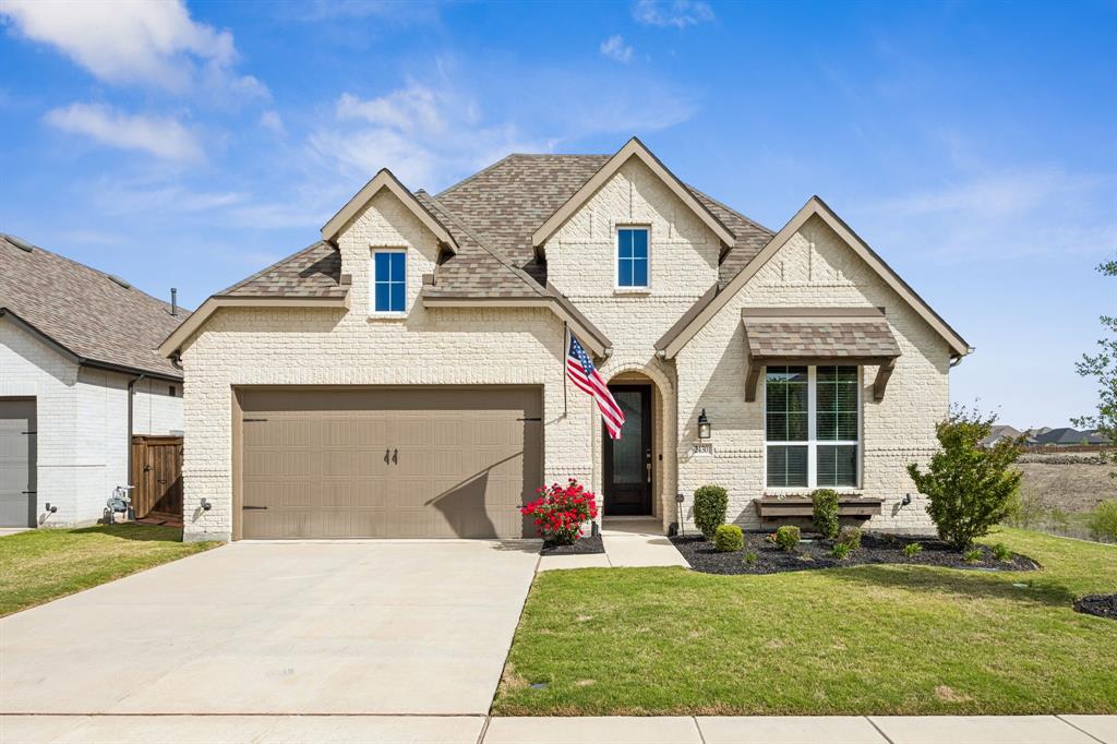 2430 Brightling Bend Forney, TX 75126 - Photo 13 of 37 French provincial home featuring brick siding, a front yard, a shingled roof, and driveway