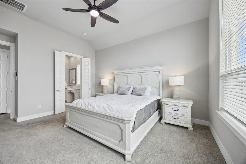 2430 Brightling Bend Forney, TX 75126 - Photo 22 of 37 Primary bedroom with vaulted ceiling and ceiling fan