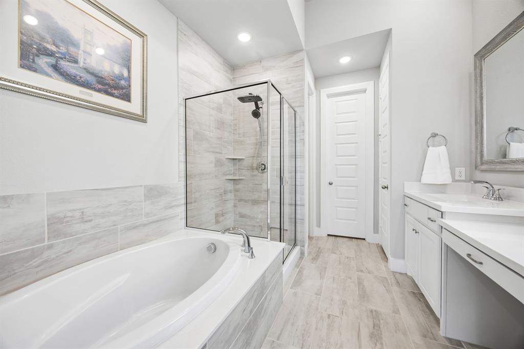 2430 Brightling Bend Forney, TX 75126 - Photo 25 of 37 Ensuite bathroom with double vanity, a garden tub, a shower stall, and recessed lighting