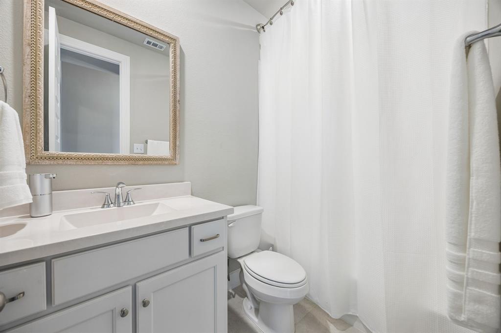 2430 Brightling Bend Forney, TX 75126 - Photo 27 of 37 Secondary bathroom with toilet and light tile patterned floors