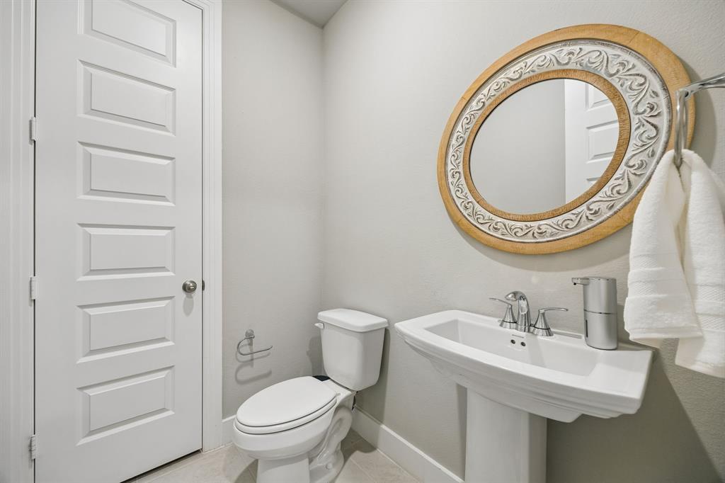 2430 Brightling Bend Forney, TX 75126 - Photo 30 of 37 Powder bath with toilet and light tile patterned floors