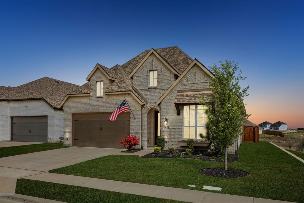 2430 Brightling Bend Forney, TX 75126 - Photo 3 of 37 French country style house with brick siding, a lawn, driveway, and roof with shingles