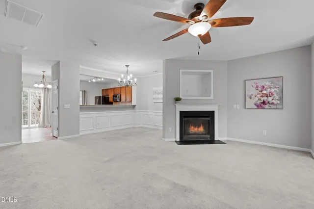 a view of a living room a window and a fireplace