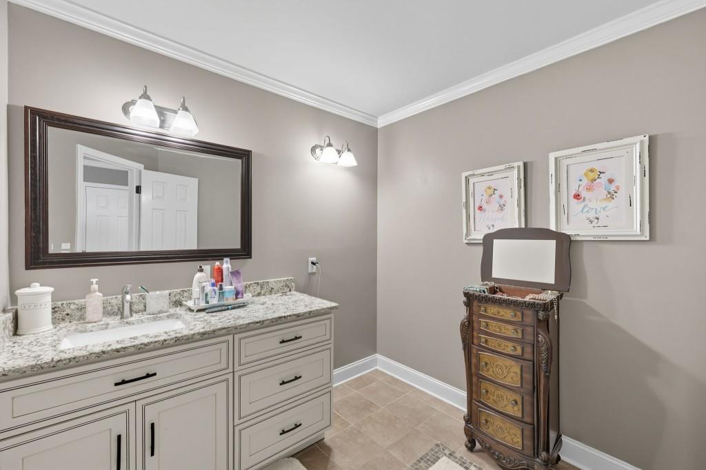 3810 Hardy Place Gainesville, GA 30506 - Photo 15 of 34 a bathroom with a toilet a sink and mirror