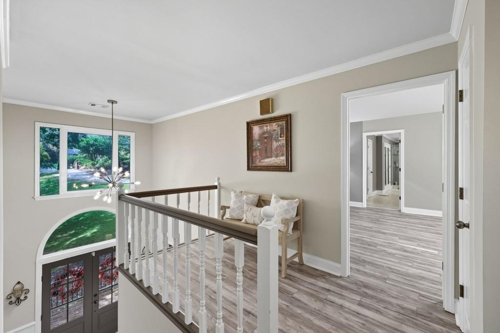 3810 Hardy Place Gainesville, GA 30506 - Photo 17 of 34 a view of a hallway with wooden floor and stairs