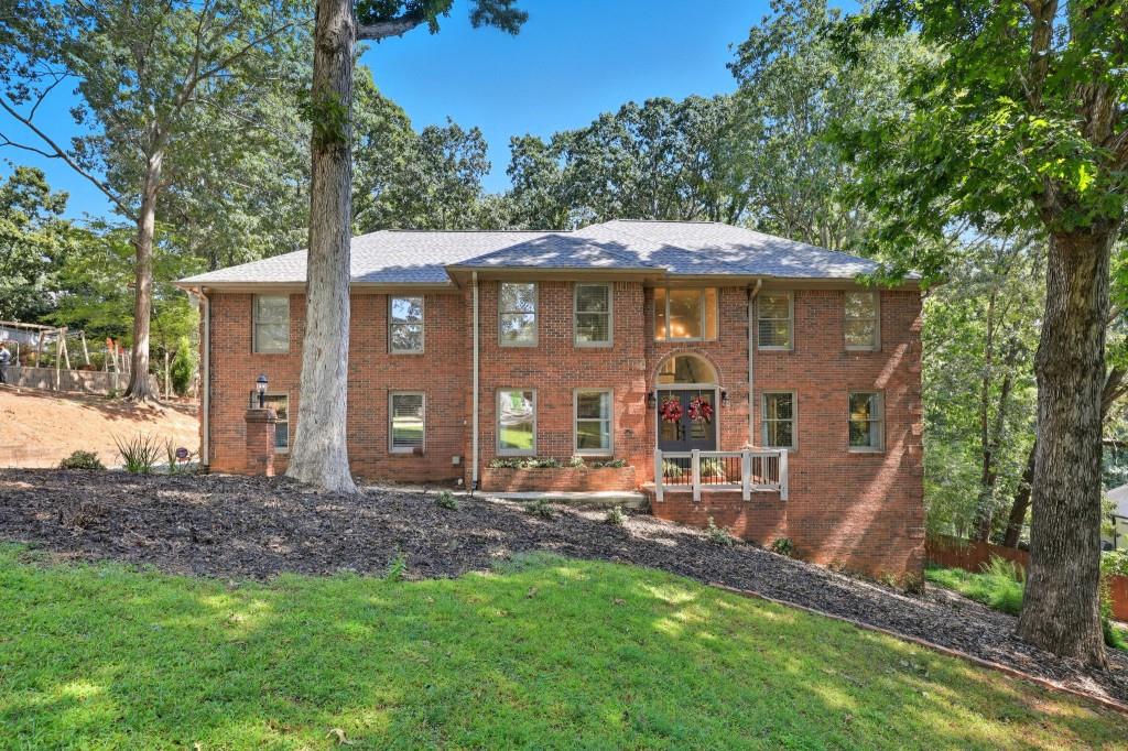 3810 Hardy Place Gainesville, GA 30506 - Photo 2 of 34 a front view of a house with a yard