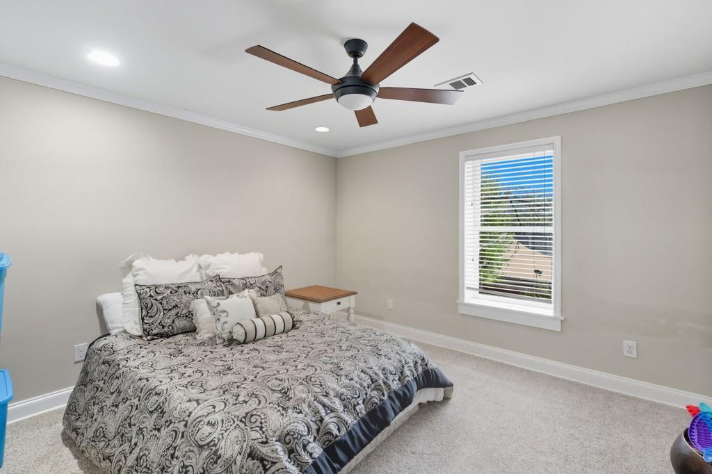 3810 Hardy Place Gainesville, GA 30506 - Photo 23 of 34 a bed sitting in a bedroom next to a window