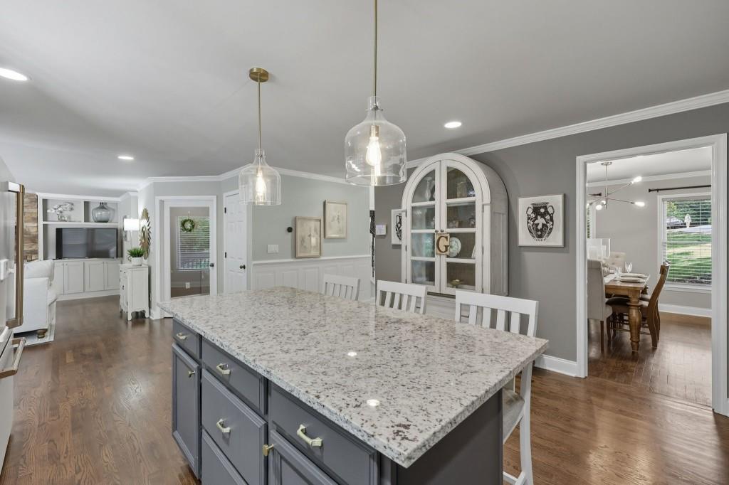 3810 Hardy Place Gainesville, GA 30506 - Photo 29 of 33 an open kitchen with a table and chairs
