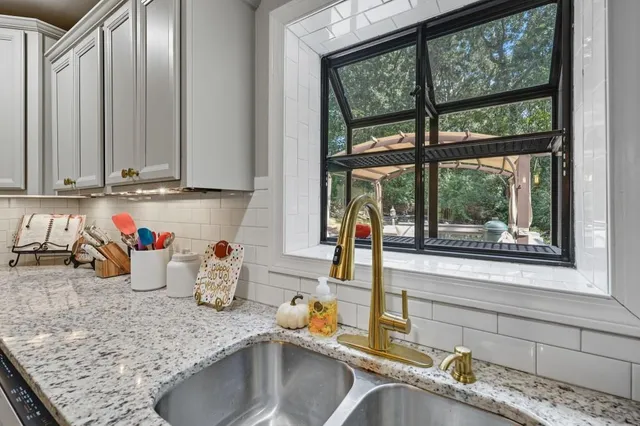 an open kitchen with a table and chairs