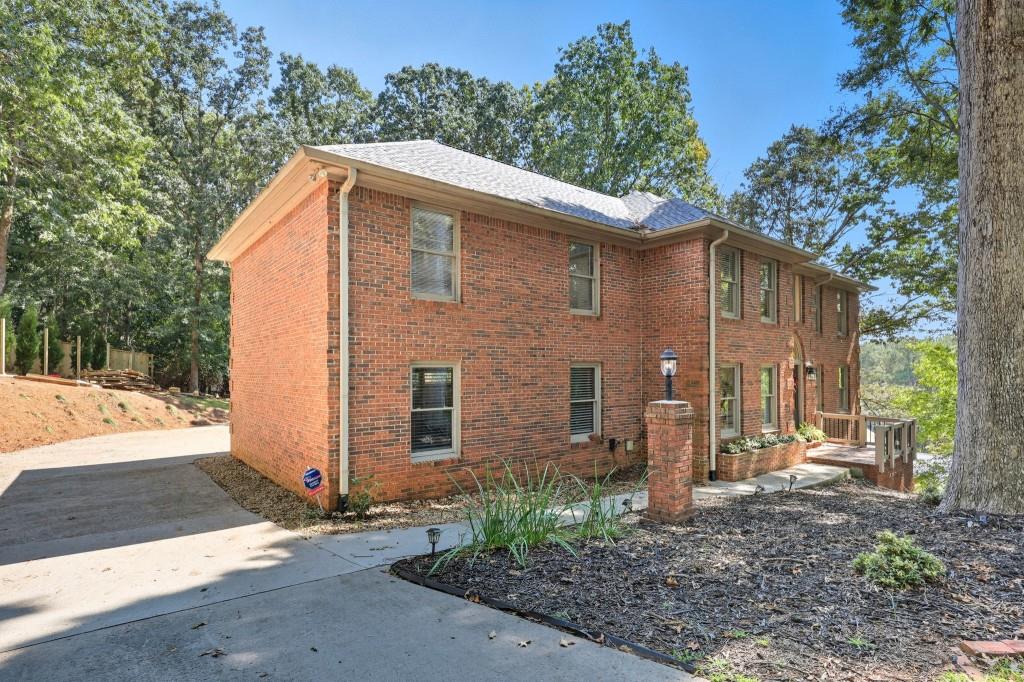 3810 Hardy Place Gainesville, GA 30506 - Photo 3 of 34 a backyard of a house with lots of green space