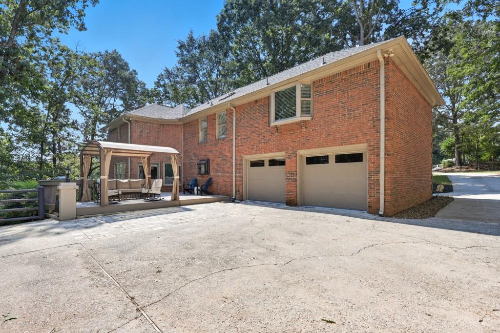 3810 Hardy Place Gainesville, GA 30506 - Photo 31 of 33 a front view of a house with a yard and garage