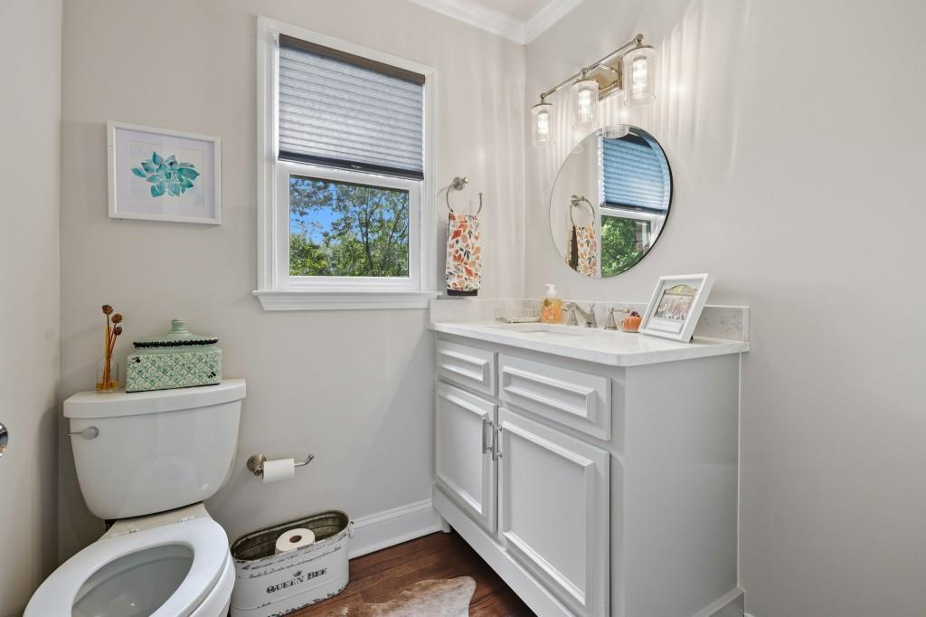 3810 Hardy Place Gainesville, GA 30506 - Photo 8 of 33 a bathroom with a toilet sink and mirror