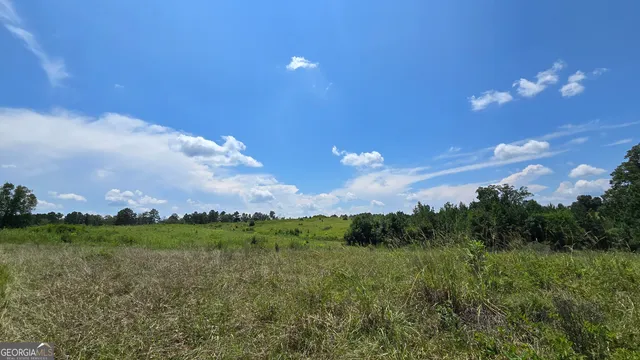 a view of a lake with a big yard