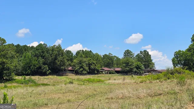 a view of a lake with a house in the background