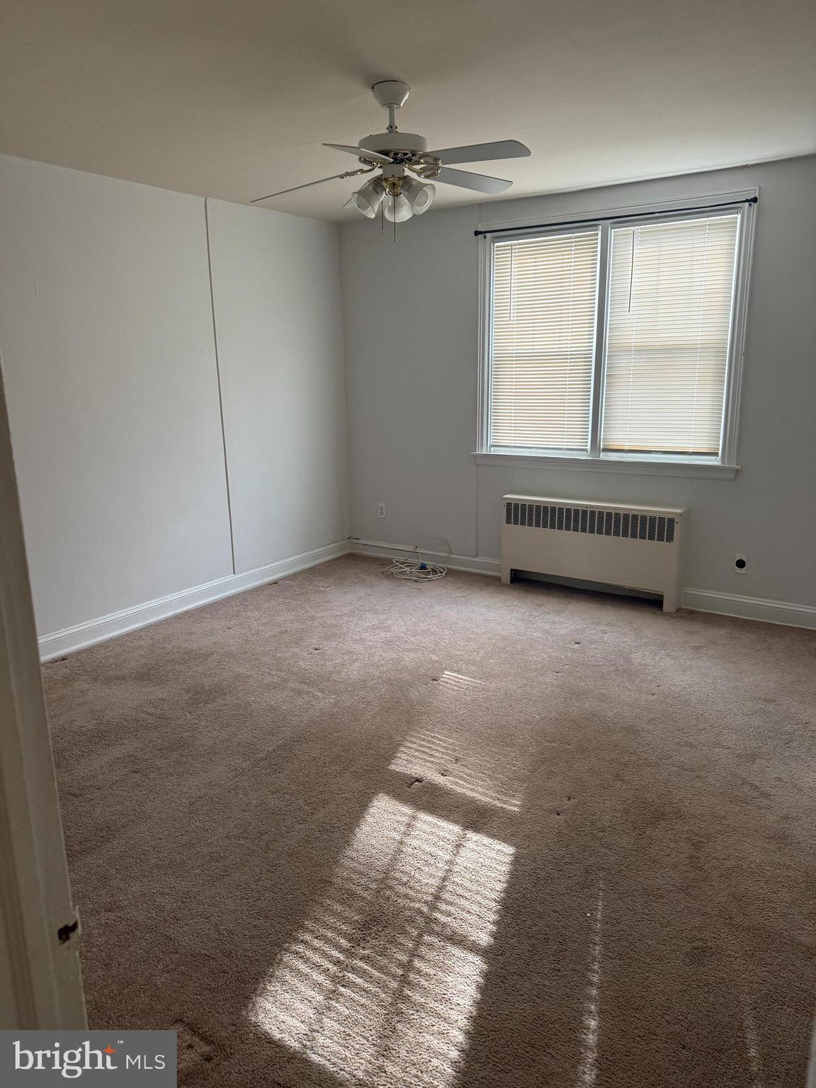 112 Fairfield Lane, Unit 1 Wayne, PA 19087 - Photo 8 of 9 a view of an empty room with a window