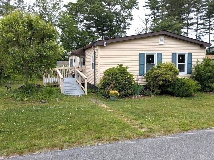 41 Pipers Way Carver, MA 02330 - Photo 34 of 36 a white house that has a tree in front of it