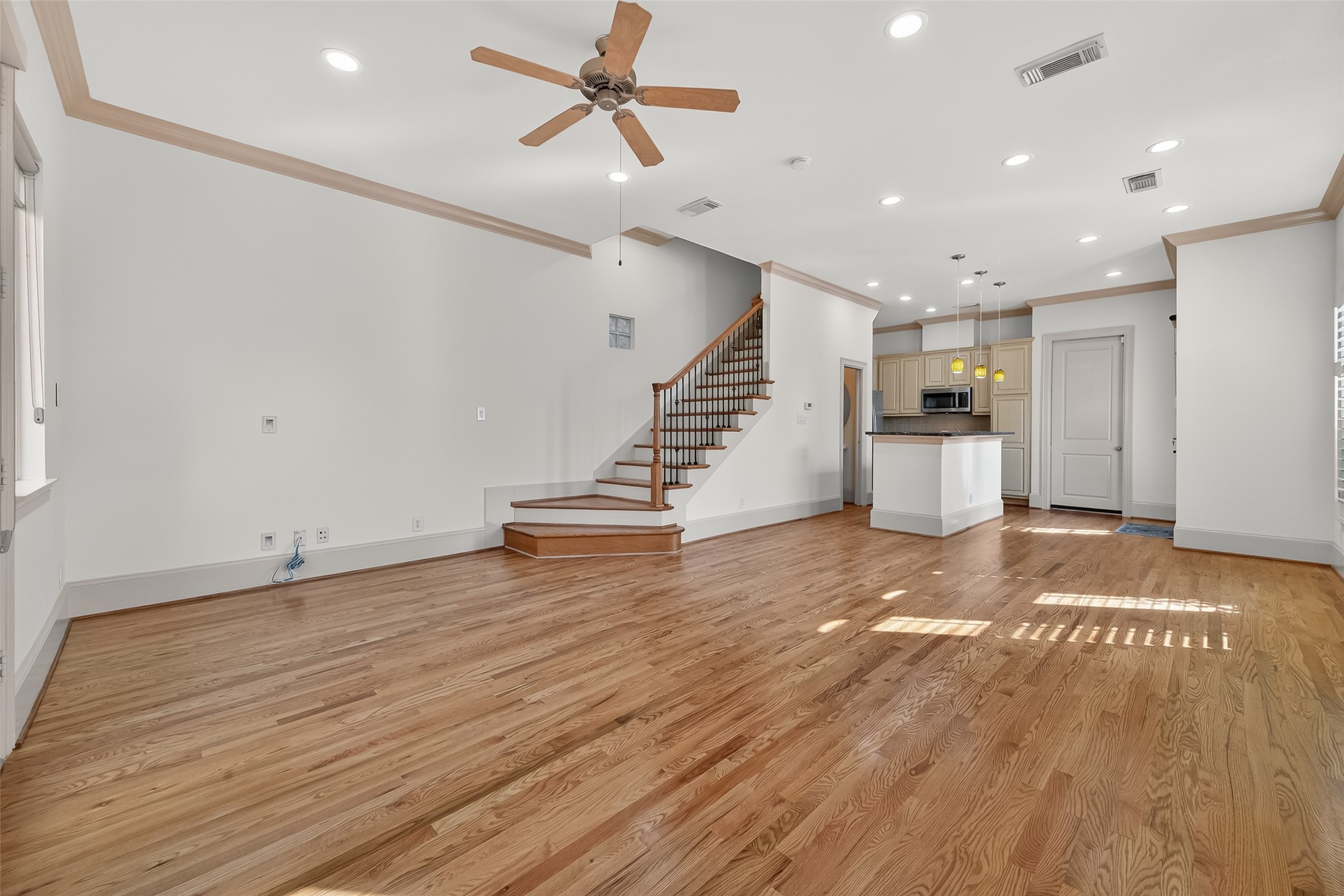 931 West 23rd Street, Unit K Houston, TX 77008 - Photo 4 of 40 Come into the open 1st floor living with 3/4" red oak hardwood floors, large windows and 2024 interior paint.