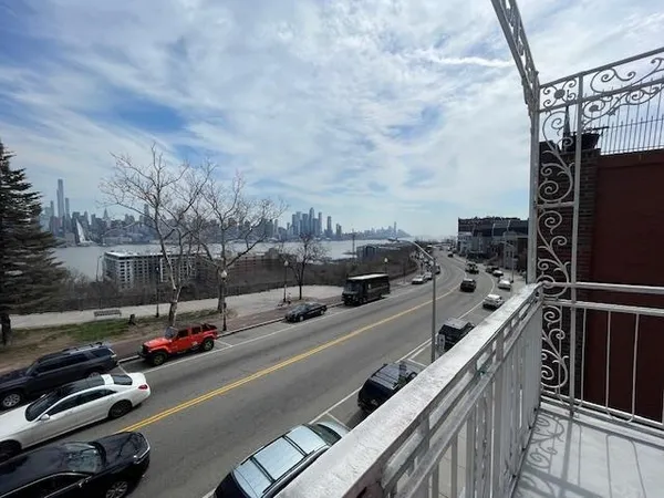 a view of a city street from a roof