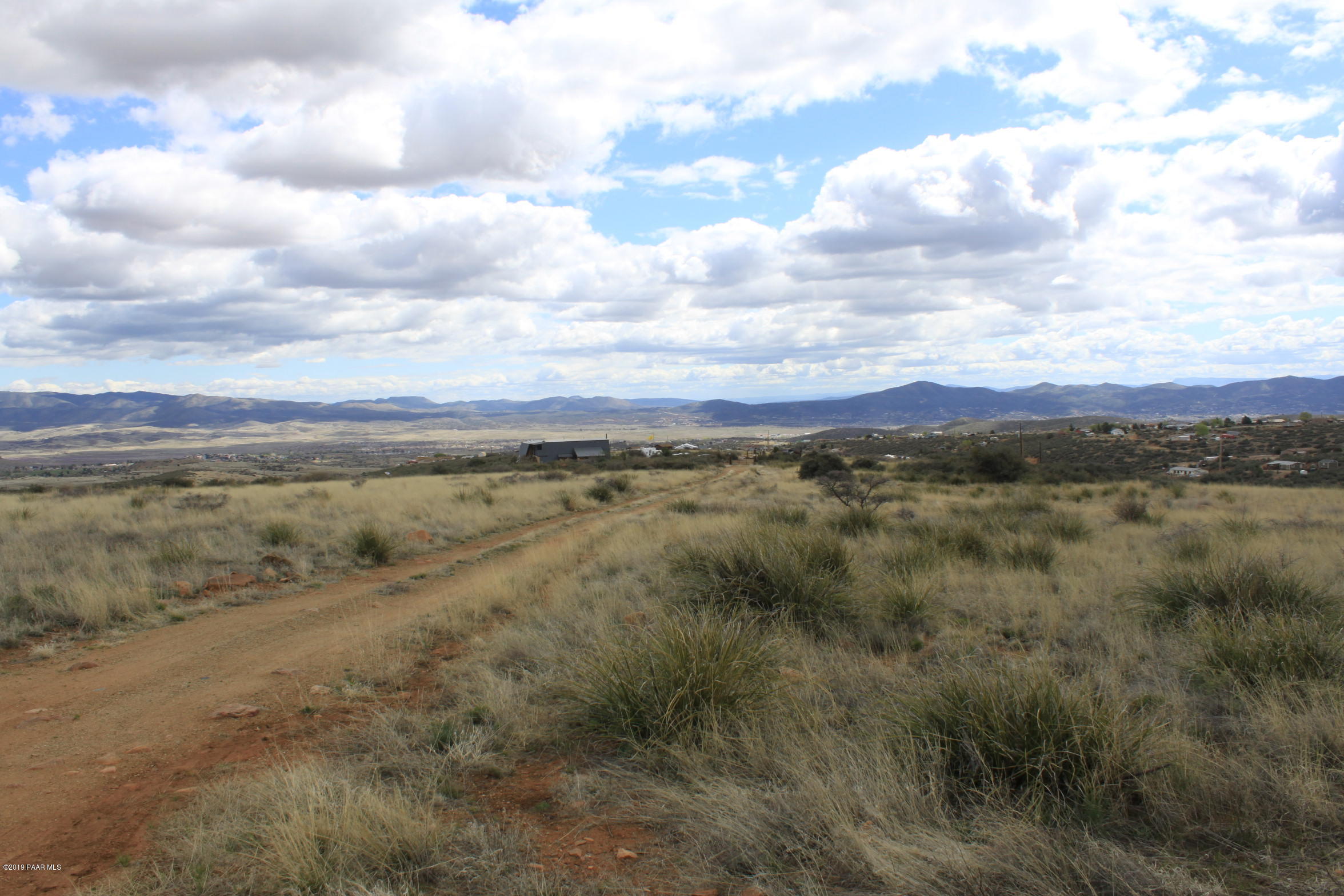 9240 Wolf Road Dewey-Humboldt, AZ 86327 - Photo 4 of 14 a view of a field with trees in the background