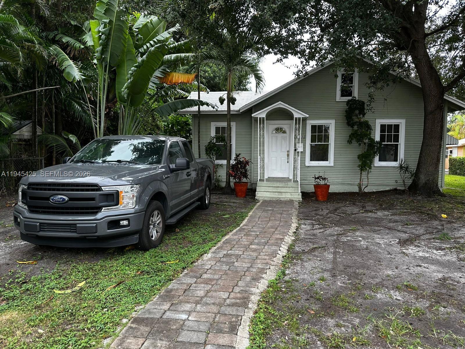 a view of a car in front of house