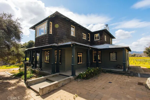 a view of entryway livingroom and hall with wooden floor