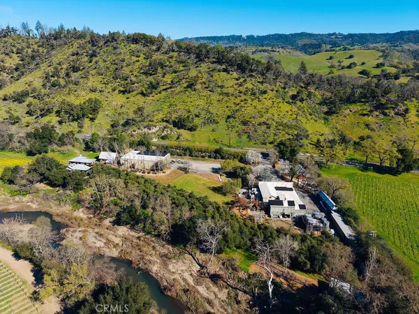 an aerial view of multiple houses with yard