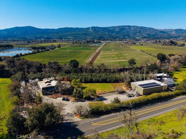 an aerial view of a house with outdoor space