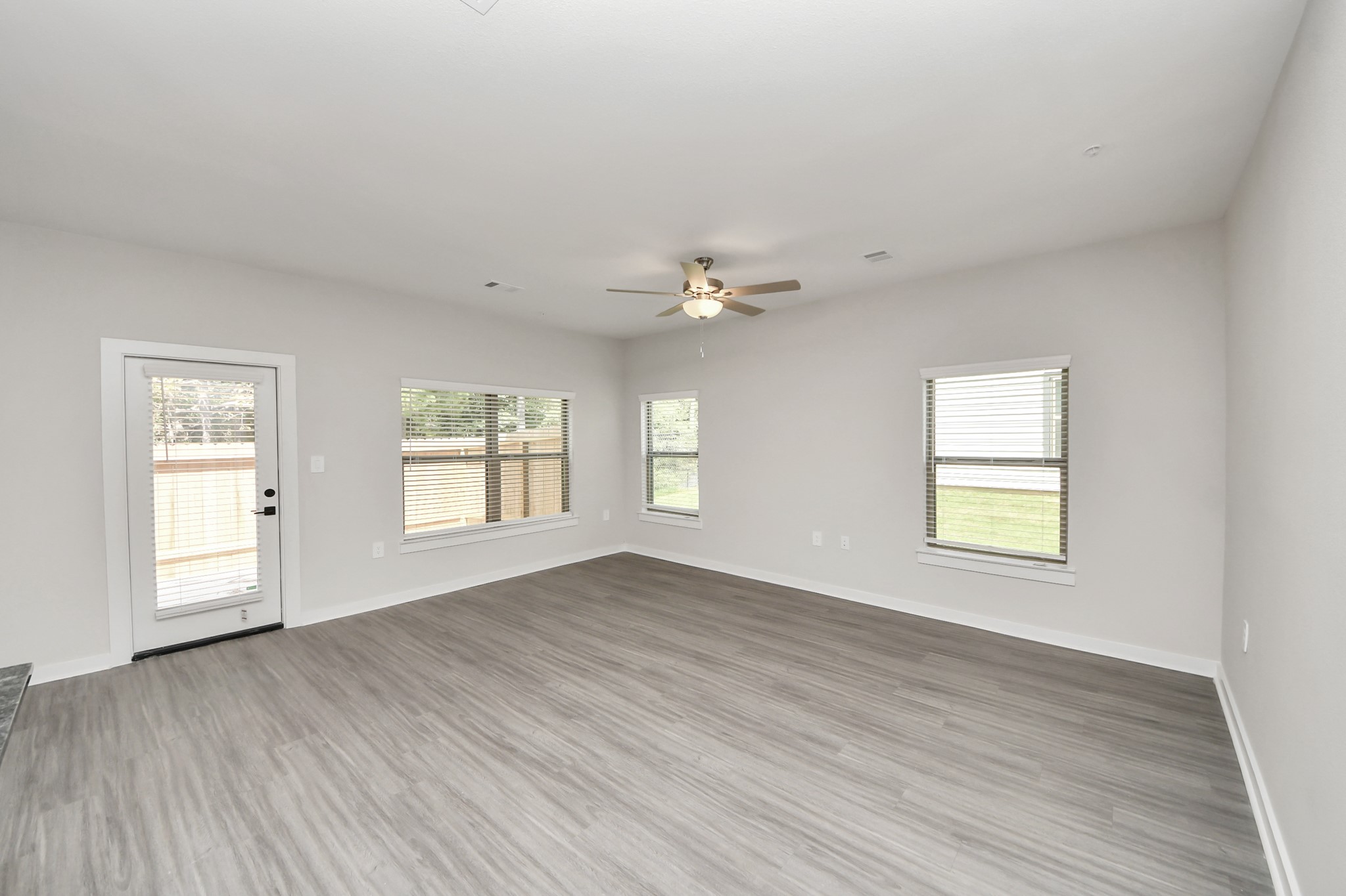 7711 Longmire Road, Unit 195 Conroe, TX 77304 - Photo 46 of 48 Boasting luxury finishes-stylish Island kitchen,granite counters,subway tile backsplash,ample custom cabinet space,stainless appliances,refrigerator,full size washer&dryer included,wood-like floors throughout,open concept floor plan.