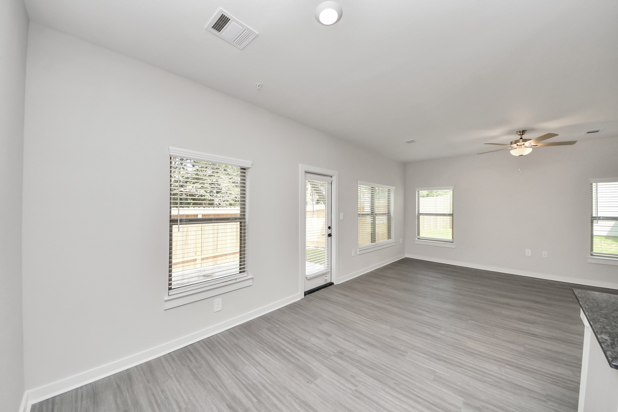 7711 Longmire Road, Unit 195 Conroe, TX 77304 - Photo 48 of 48 Boasting luxury finishes-stylish Island kitchen,granite counters,subway tile backsplash,ample custom cabinet space,stainless appliances,refrigerator,full size washer&dryer included,wood-like floors throughout,open concept floor plan.