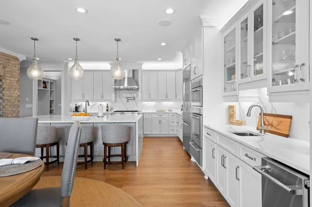 a kitchen with cabinets a sink and appliances