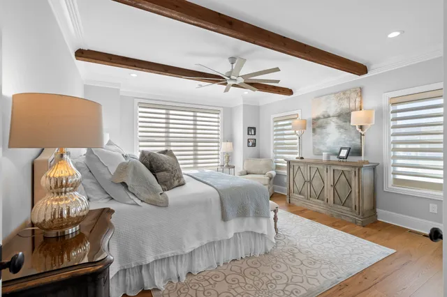 a bedroom with furniture and wooden floor