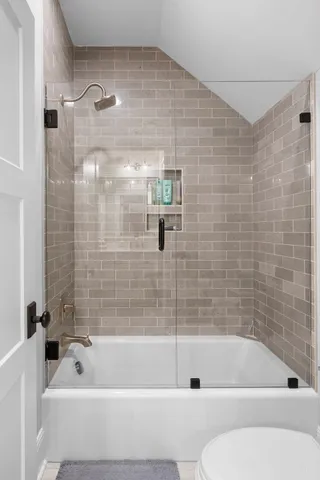 a view of a patio with table and chairs