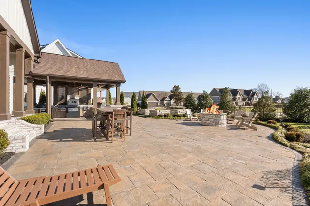an aerial view of a residential houses with outdoor space