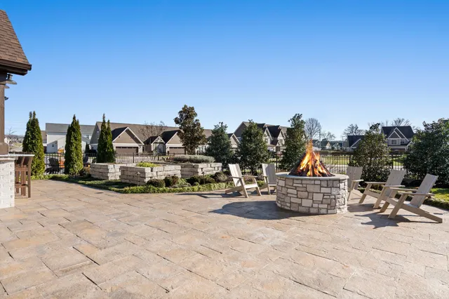 an aerial view of a house swimming pool a garden and patio