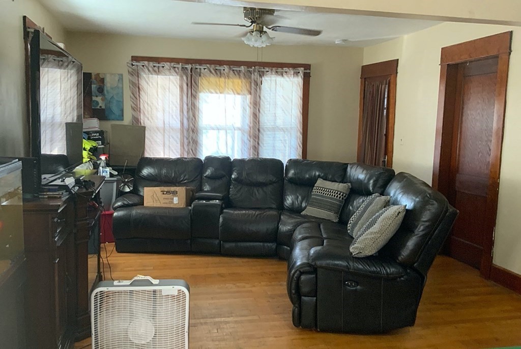 41-43 Miller Street Springfield, MA 01104 - Photo 3 of 14 a living room with furniture and a window
