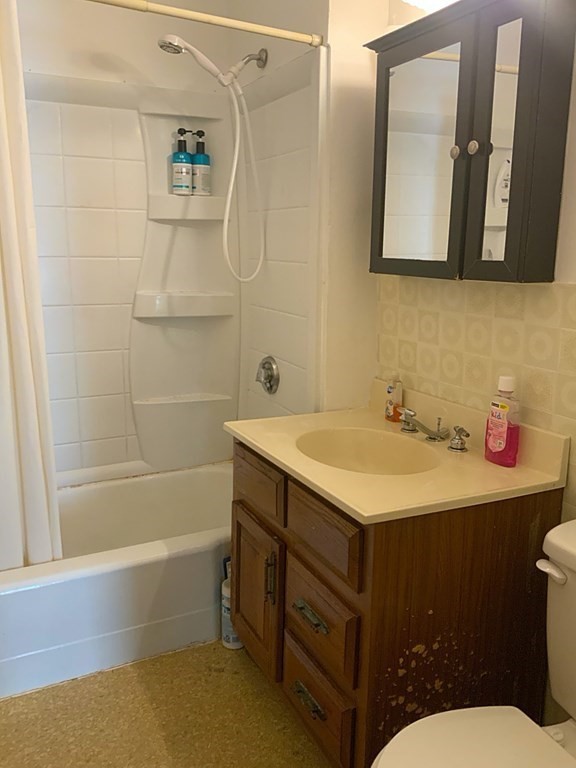 41-43 Miller Street Springfield, MA 01104 - Photo 5 of 14 a bathroom with a sink and a mirror