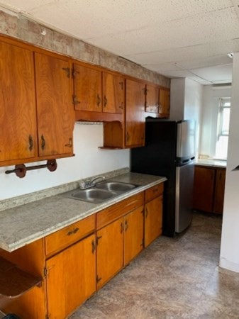 41-43 Miller Street Springfield, MA 01104 - Photo 8 of 14 a kitchen with stainless steel appliances granite countertop a sink stove and refrigerator