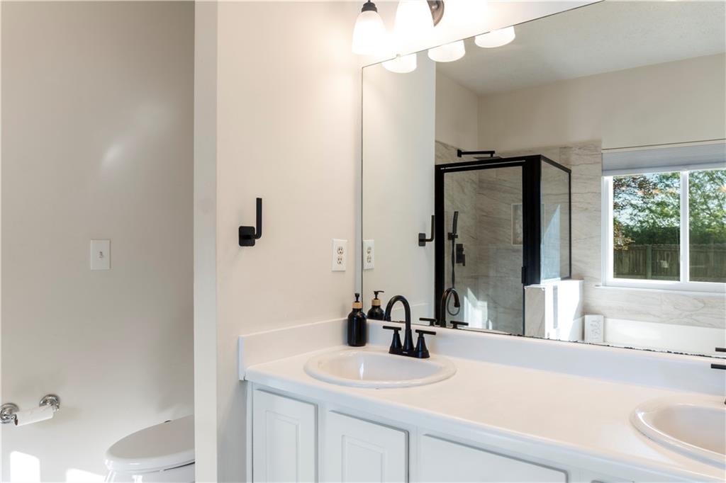 48 Hampton Drive Cartersville, GA 30121 - Photo 16 of 29 a bathroom with a sink and a mirror